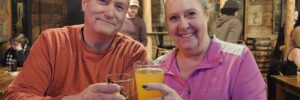 Donna Oliver and husband in front of Interstate Bowling & Town Line Sports Grille